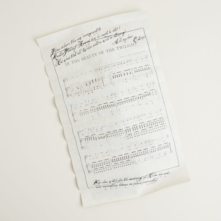 unrolled scroll featuring sheet music
