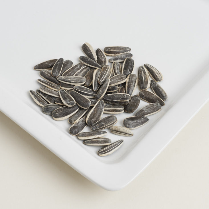 Yes salted striped lithuanian sunflower seeds on a plate