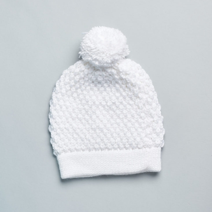 white hat with pompom