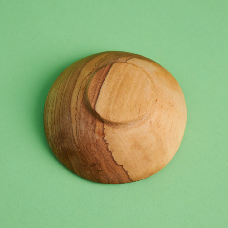 bottom of handmade wood and bone condiment bowl from kenya