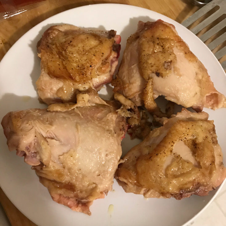 cooked chicken thighs on a plate