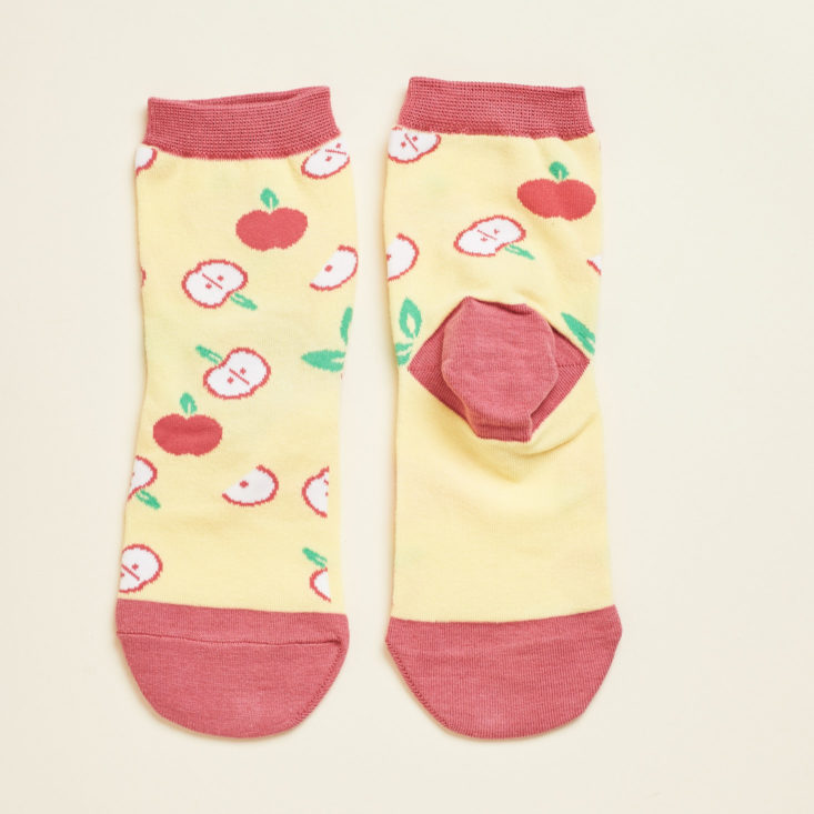 These socks have a fun apple pattern and a contrast heel.