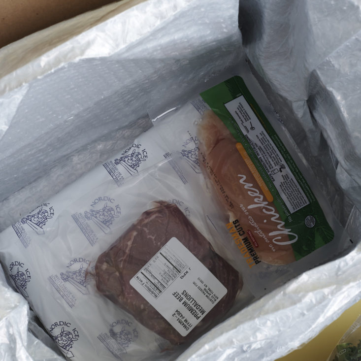 ice pack and meat in blue apron box