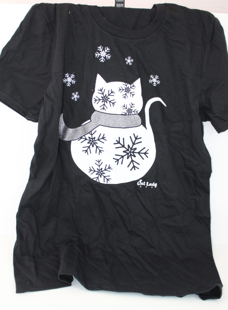 black t-shirt with white cat and snowflake graphic