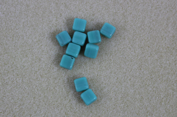 small square shaped beads in a turquoise color