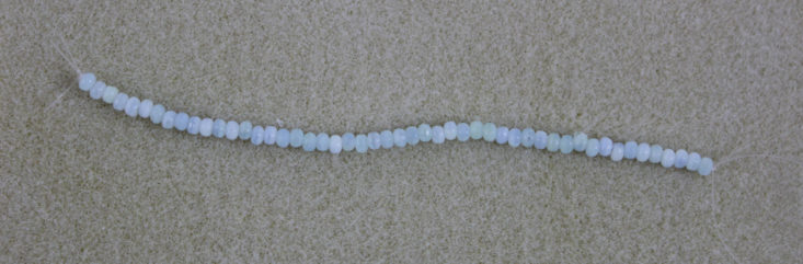 small turquoise rondelle beads on a string