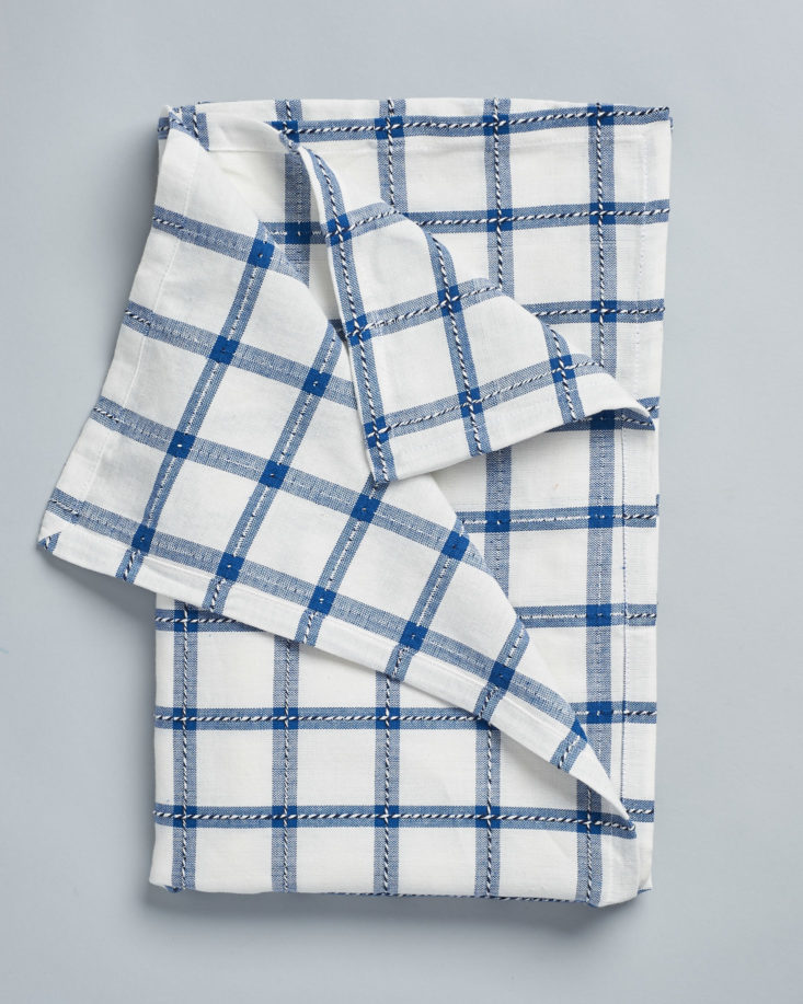 This blue-gridded dishcloth folds up neatly for storage.