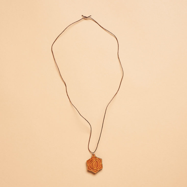 long wooden necklace with charm