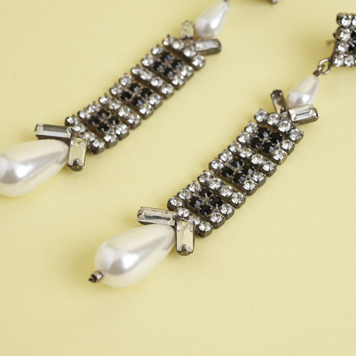 close up of bottom of 1930s pearl costume jewelry earrings