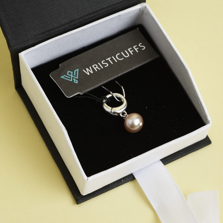 Single pink pearl charm from wristicuffs inbox
