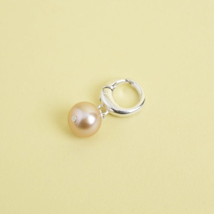 single pink pearl charm on silver clasp