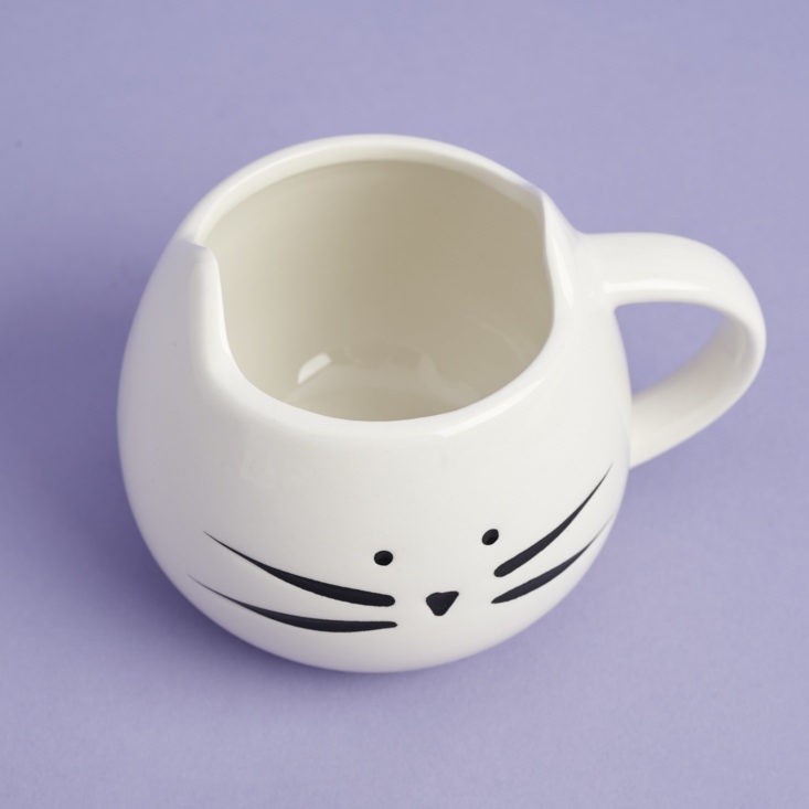 a white mug that looks like a cat's head