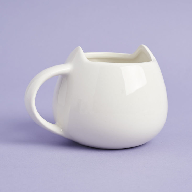 the back of a white mug that looks like a cat's head