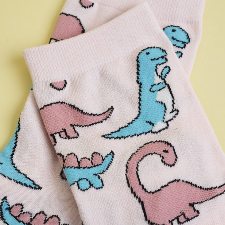 close up of Pink dinosaur socks
