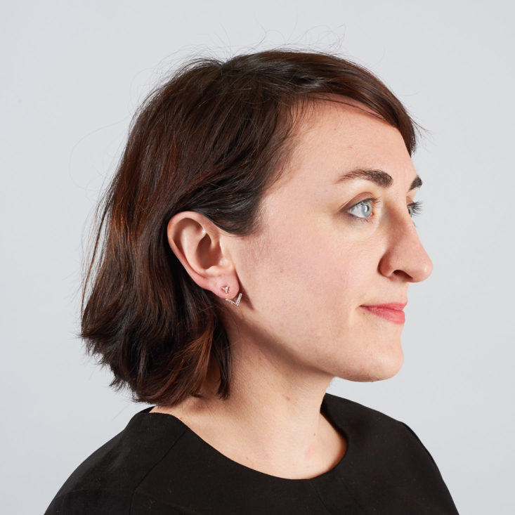 earrings on brown haired woman