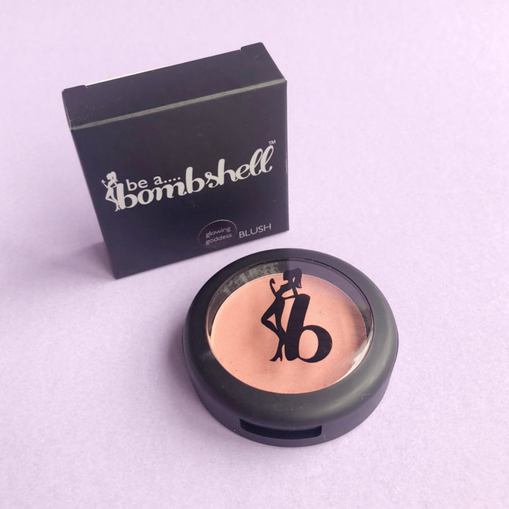 pale pink blush in a black package next to a black box