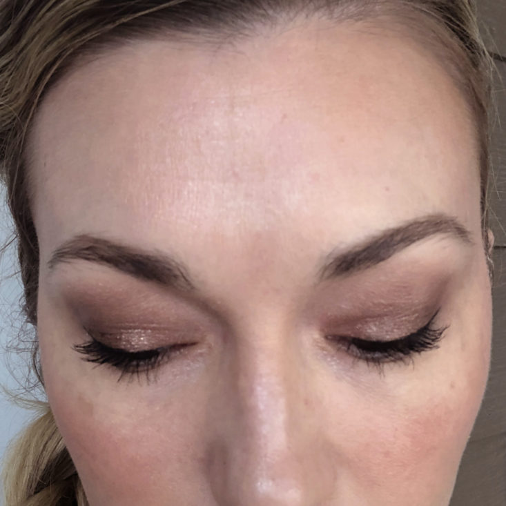 a woman modeling a brown eye look with dramatic lashes