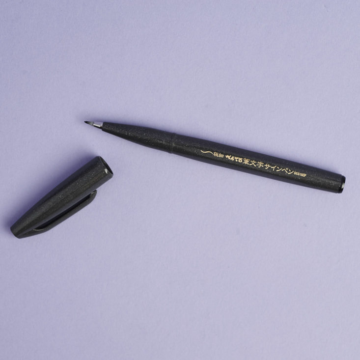 black pentel brush pen with cap off