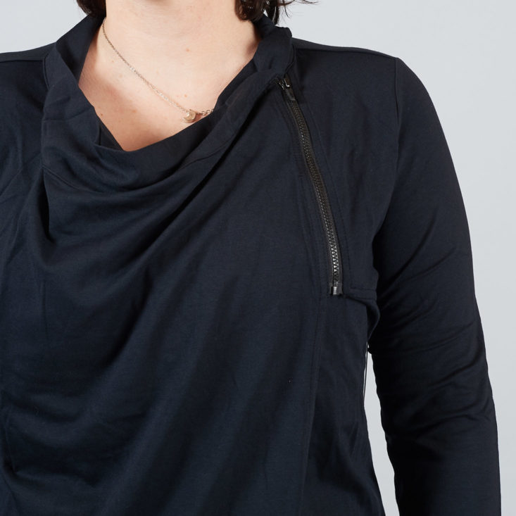 zipper on wrap style jacket worn by woman