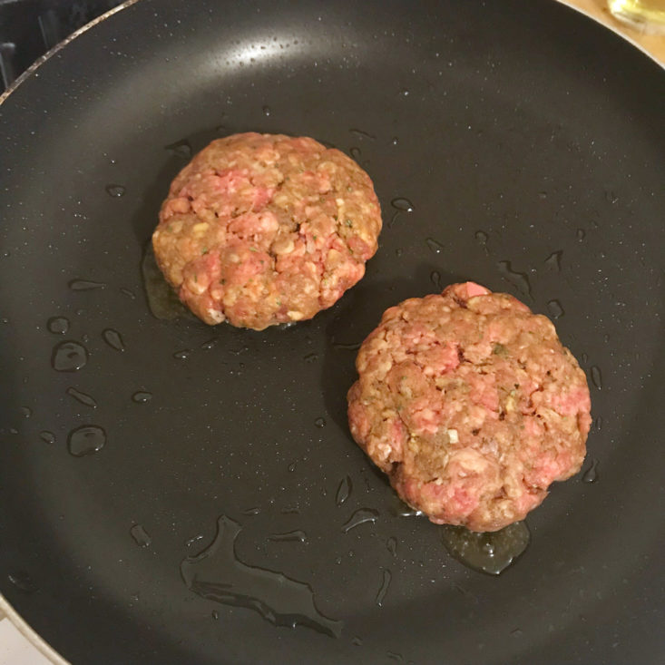 burgers cooking in pan