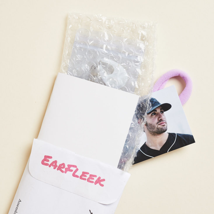 Earfleek envelope with items popping out