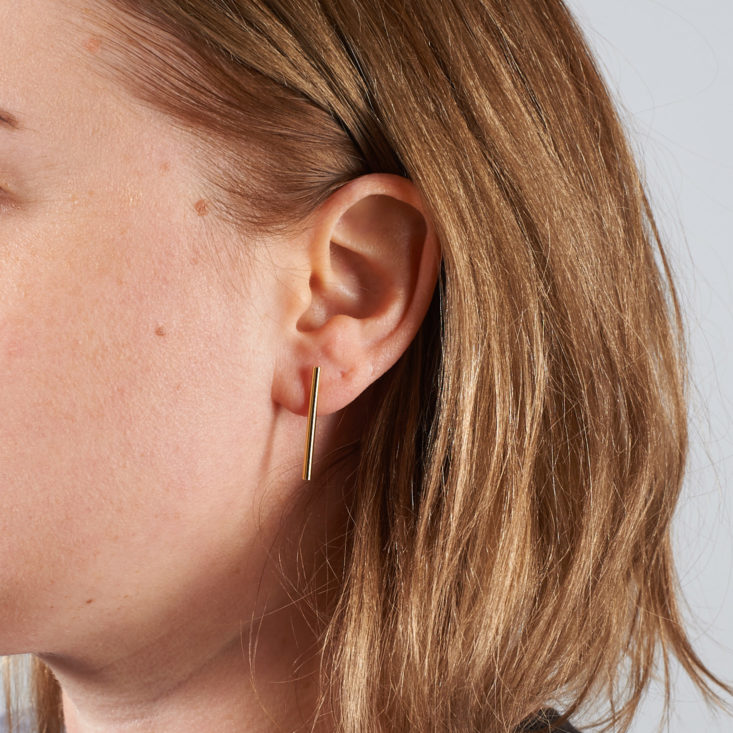 Gold Sharapova Bar earrings on model