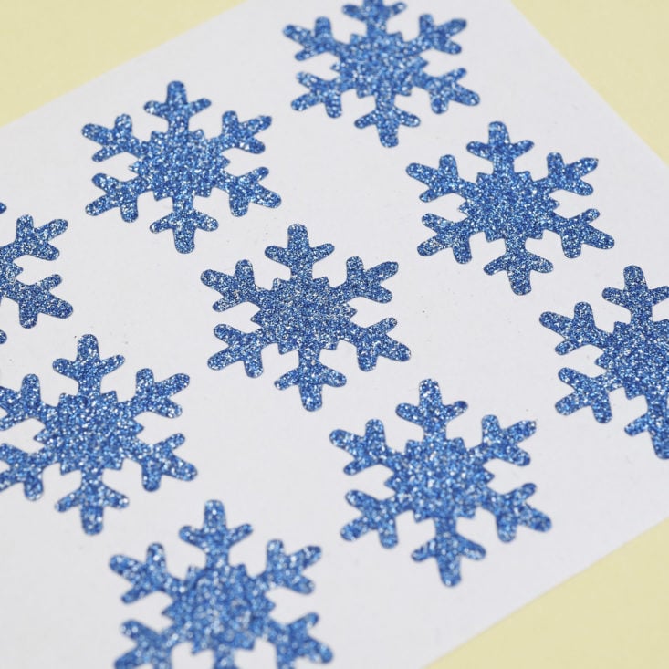 close up of blue glitter snowflake stickers