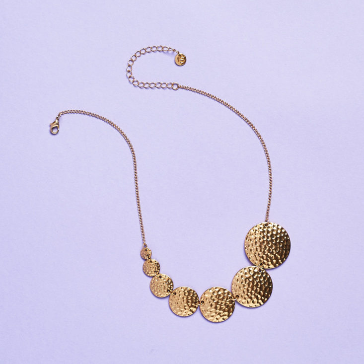 coin necklace laid flat