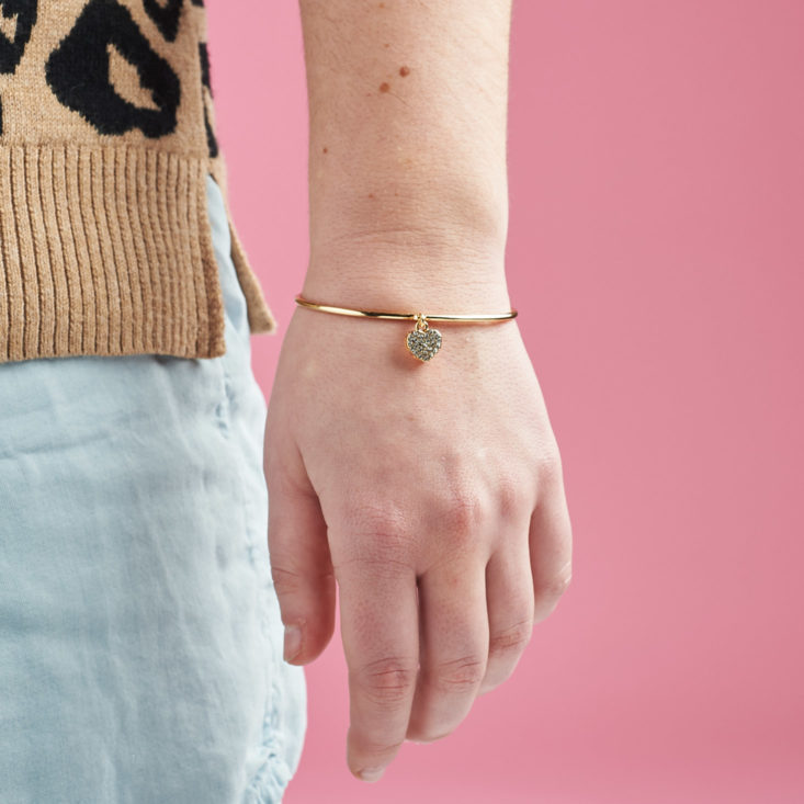 gold bracelet on person