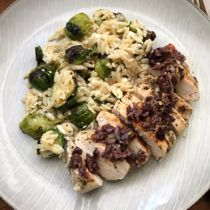Greek Chicken with olive tapenade and creamy orzo, plated