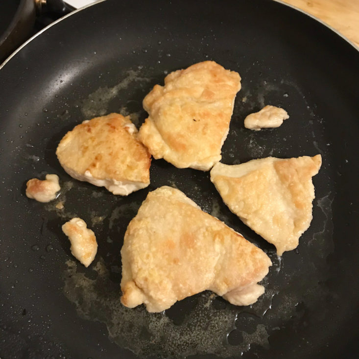 chicken cooking in pan