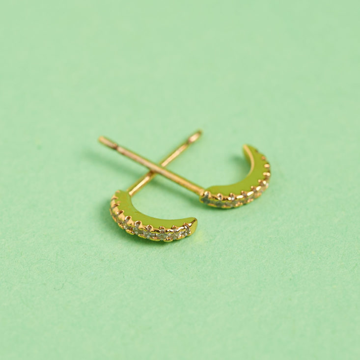 tiny earrings laid flat