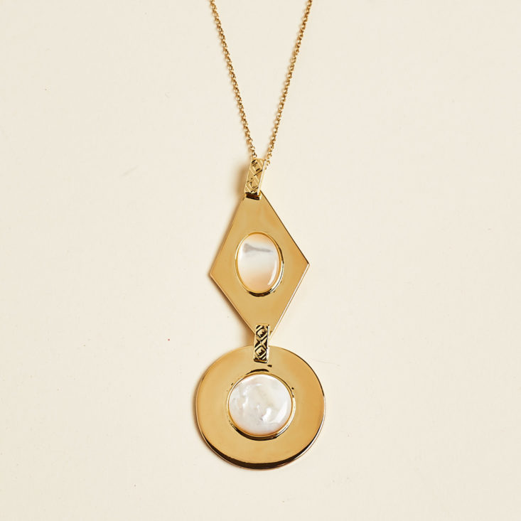 gold pendant necklace detail 