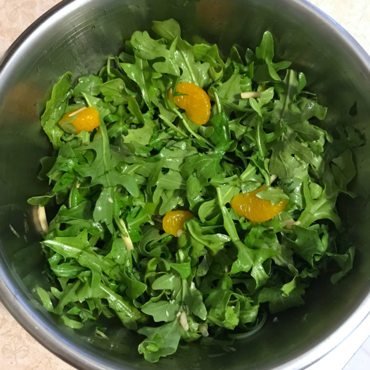 arugula salad with mandarin oranges in bowl