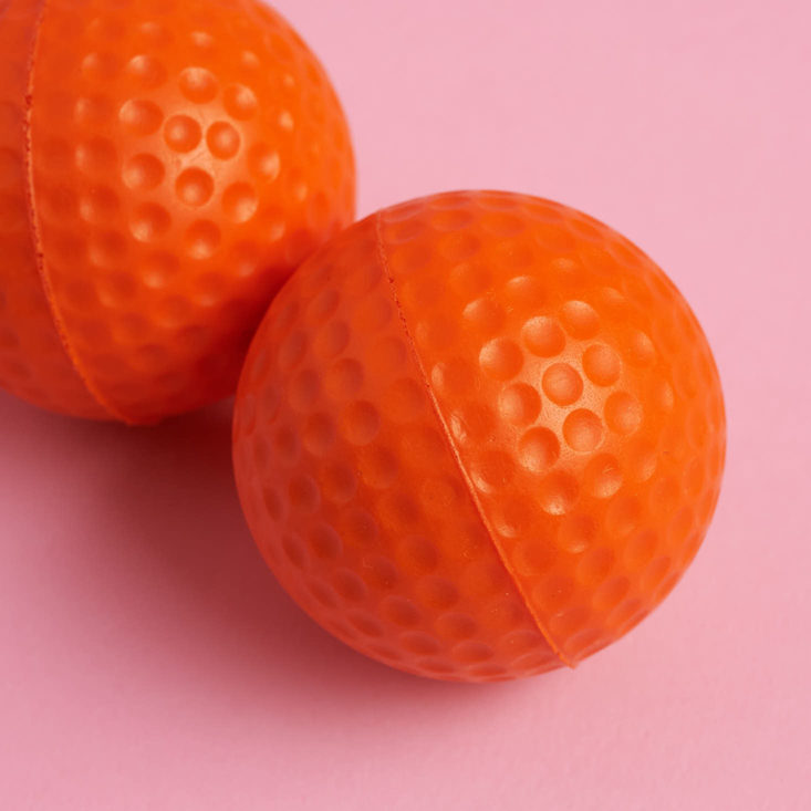 two orange golf balls