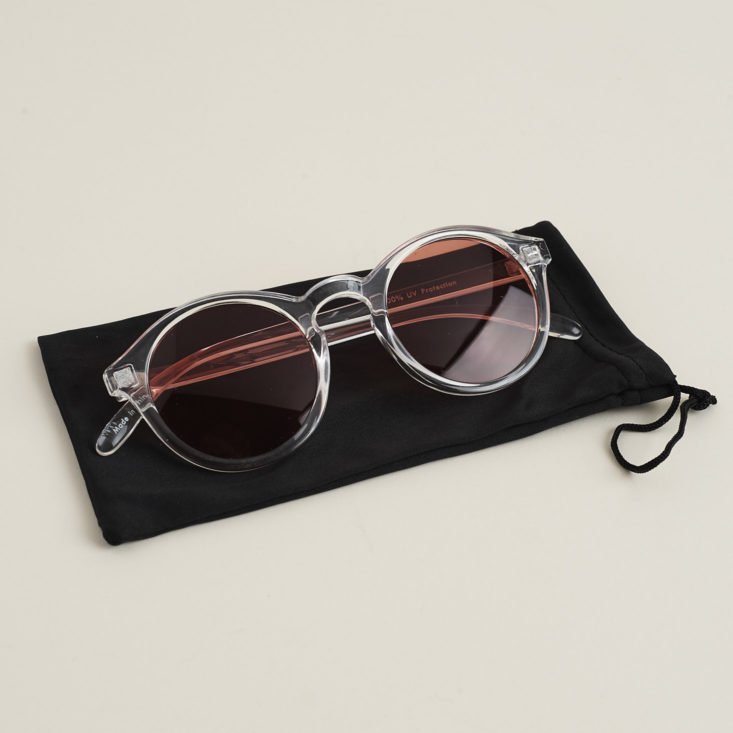 "well rounded" sunglasses with rose lenses on cloth case