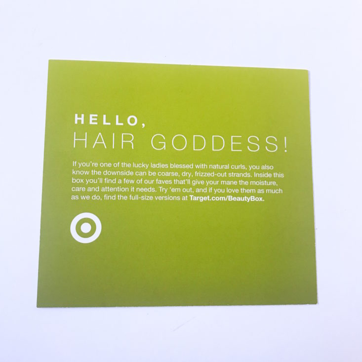 front of the lime green Target Define & Shine info card