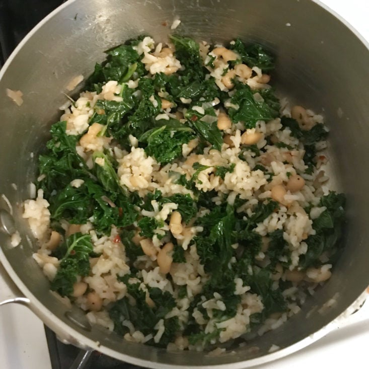 kale and bean mixture added to rice
