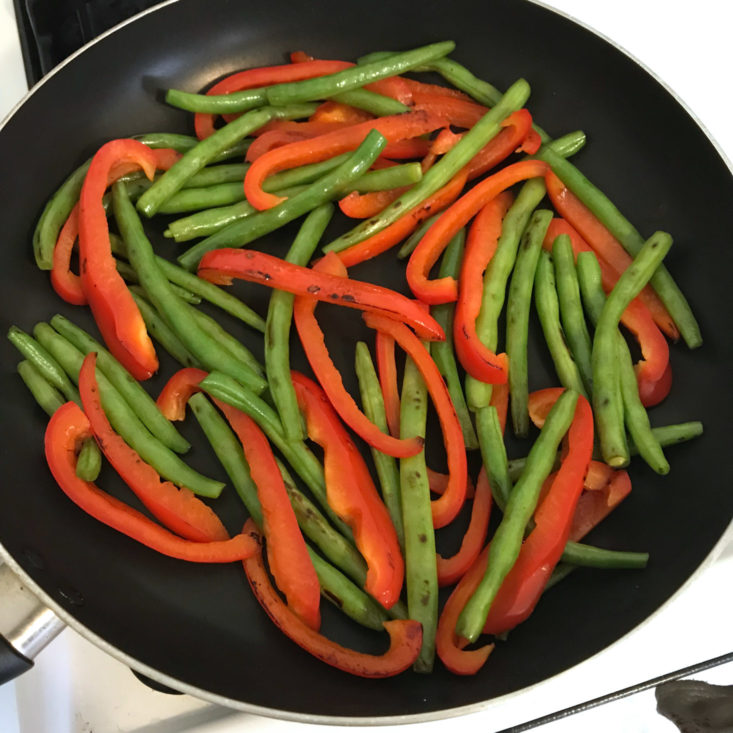 red peppers and green beans in skillet