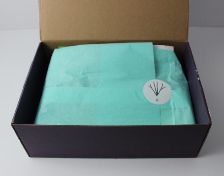 open Rawbox showing blue tissue paper