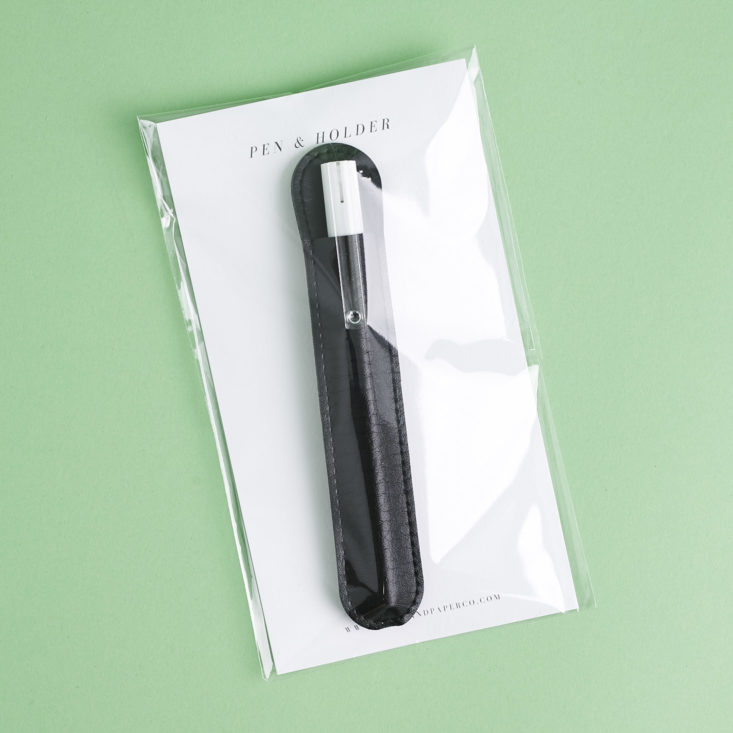 Pen with faux leather pen holder in package