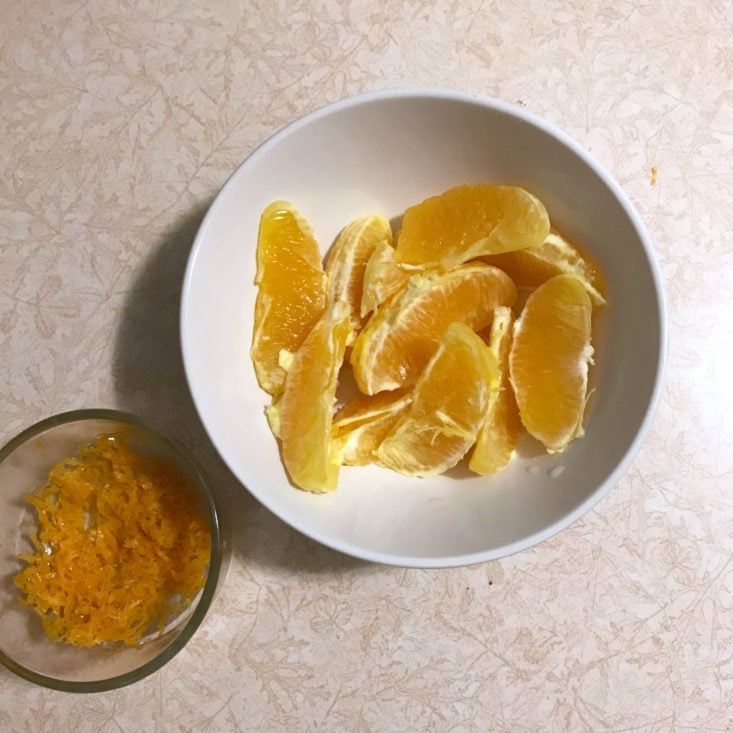 separated orange slices and zest