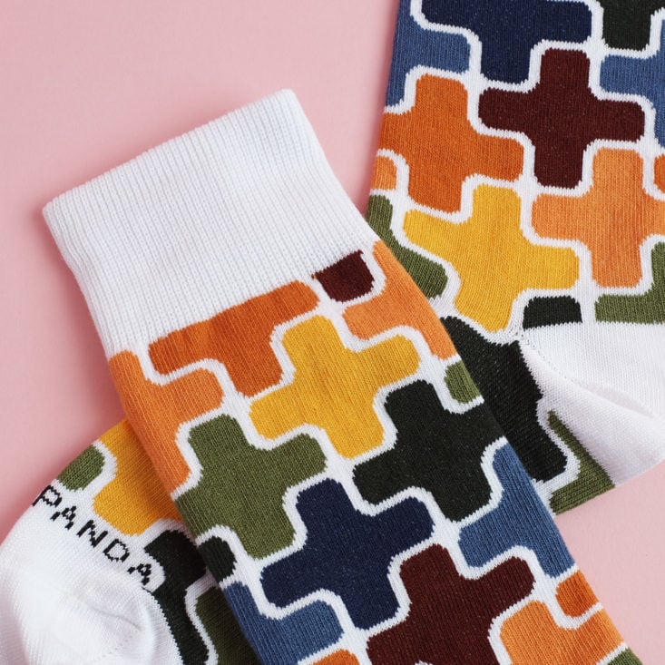 close up of colorful plus sign patterned socks