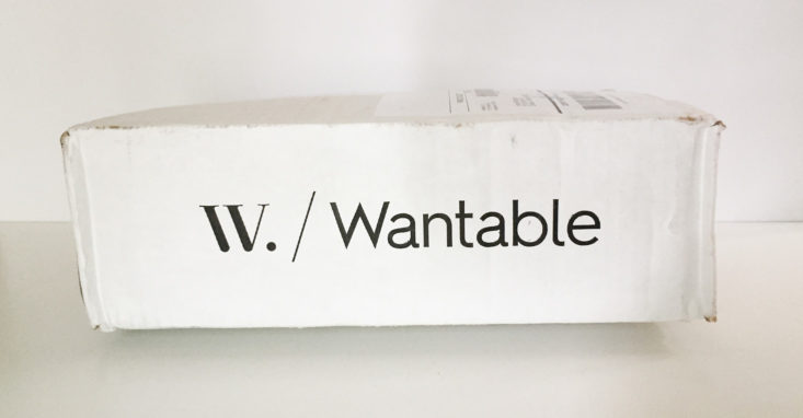 side of a white cardboard box with wantable printed in black
