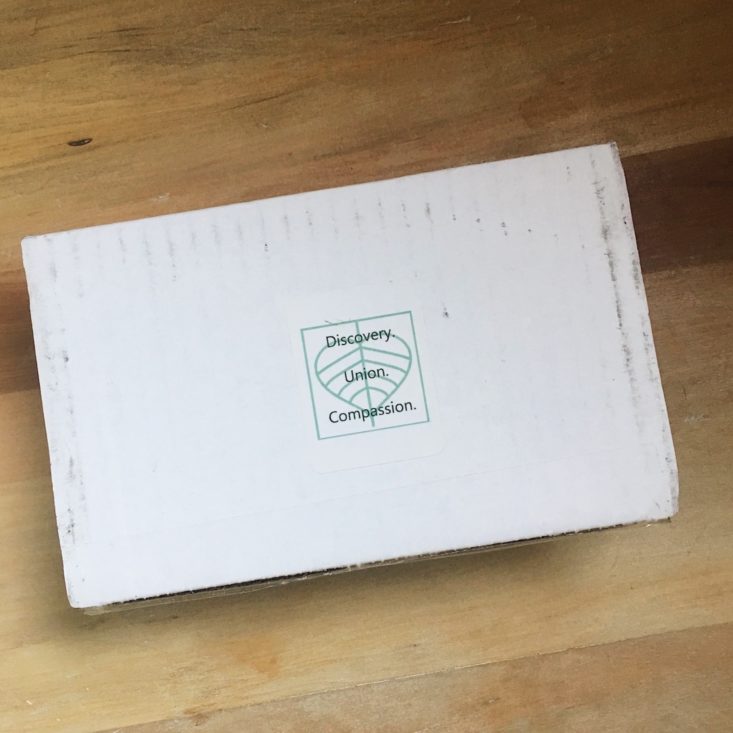 closed white box with BuddhiBox logo printed on top