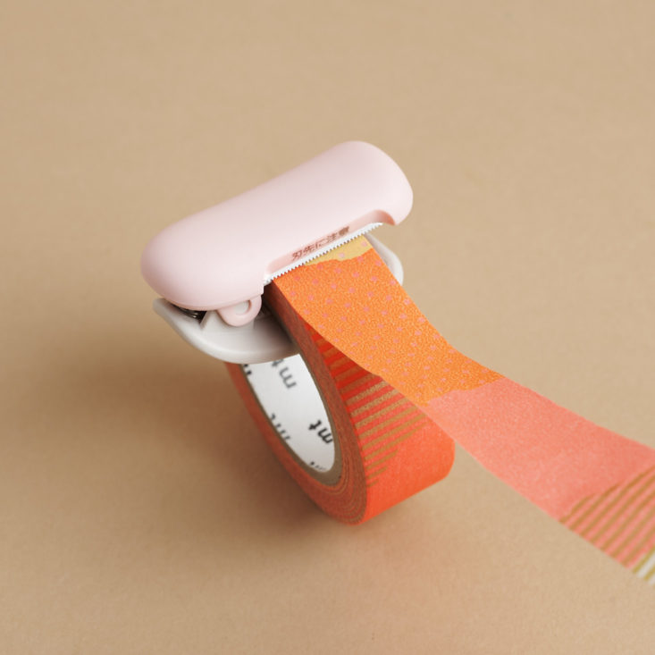 KaruCut Washi Tape Cutter on roll of tape
