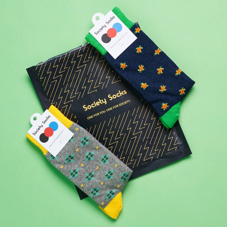 both pairs of patterned socks from my june order, as well as the sleek navy shipping envelope