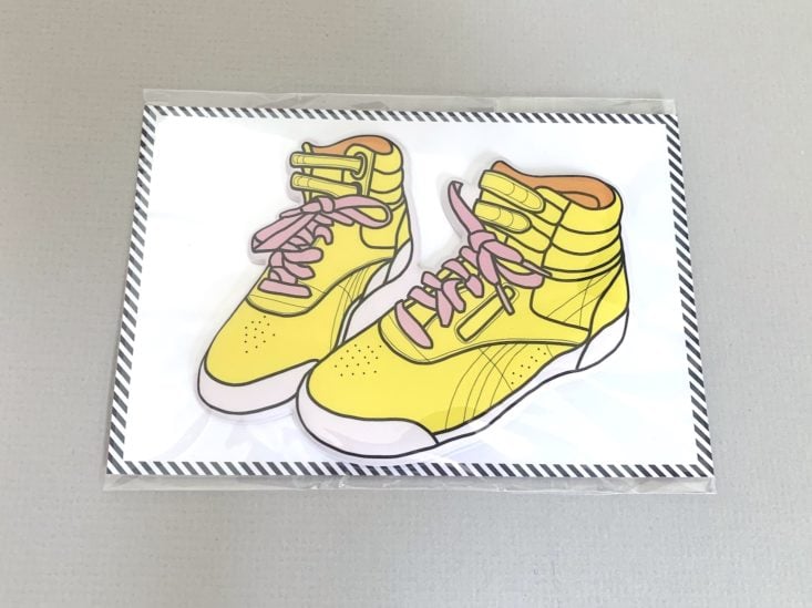 yellow high-top sneakers sticker in packaging