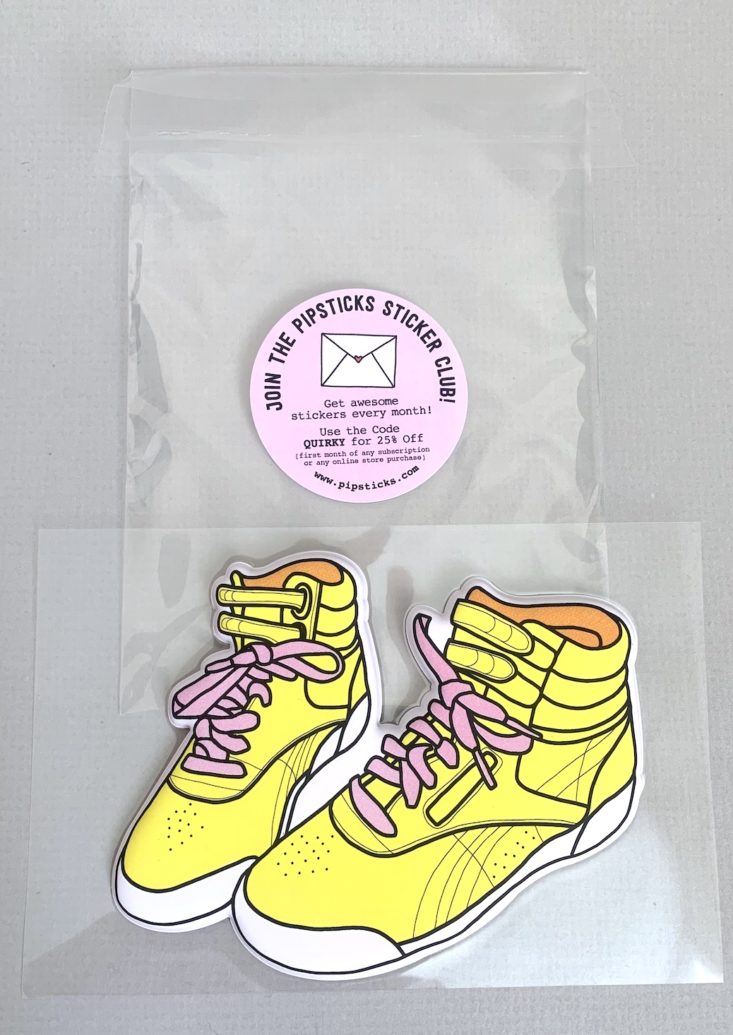 yellow high-top sneakers sticker outside of the clear plastic sleeve