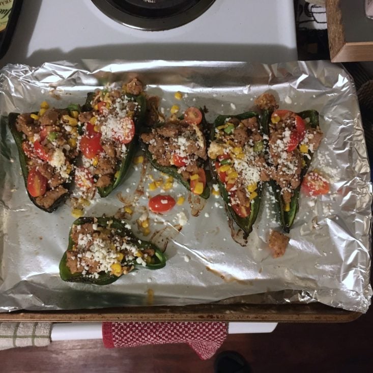 stuffed peppers stuffed with ingredients on baking tray